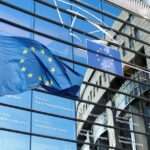 EU flag against Parliament building