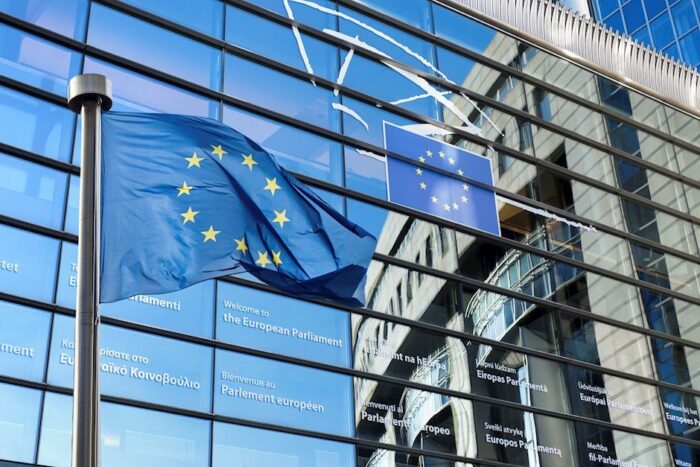 EU flag against Parliament building