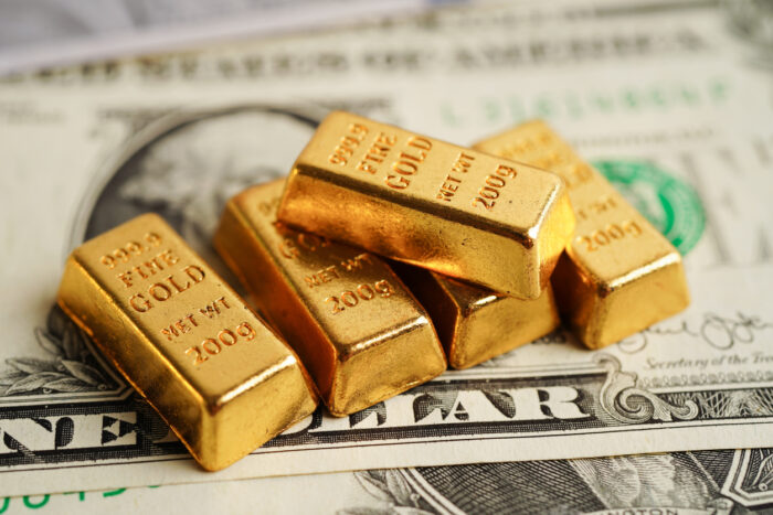 Gold over dollar bills