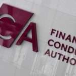 Sign for the Financial Conduct Authority (FCA) with large red FCA letters and 'Financial Conduct Authority' text on a glass-like wall.